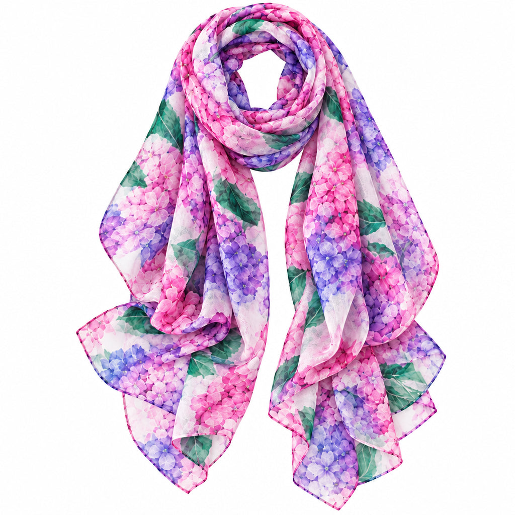 A lightweight, semi-sheer scarf featuring a vibrant watercolor floral print in shades of pink, purple, and blue with green leaves, arranged in a loop on a solid white background.