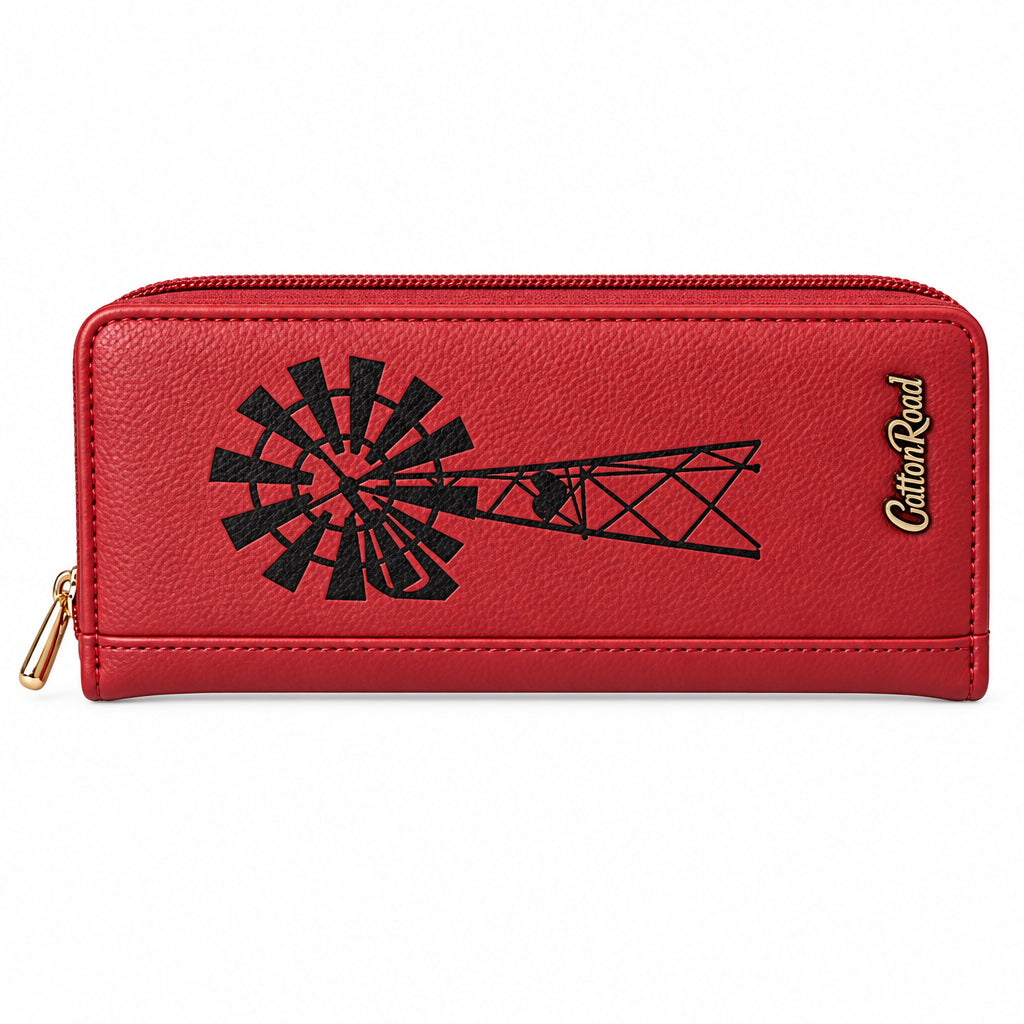 A red textured leather zip-around wallet featuring a black embossed windmill and tower graphic, a gold zipper pull, and the brand name 'Cotton Road' printed in gold on the right side, set against a solid black background.