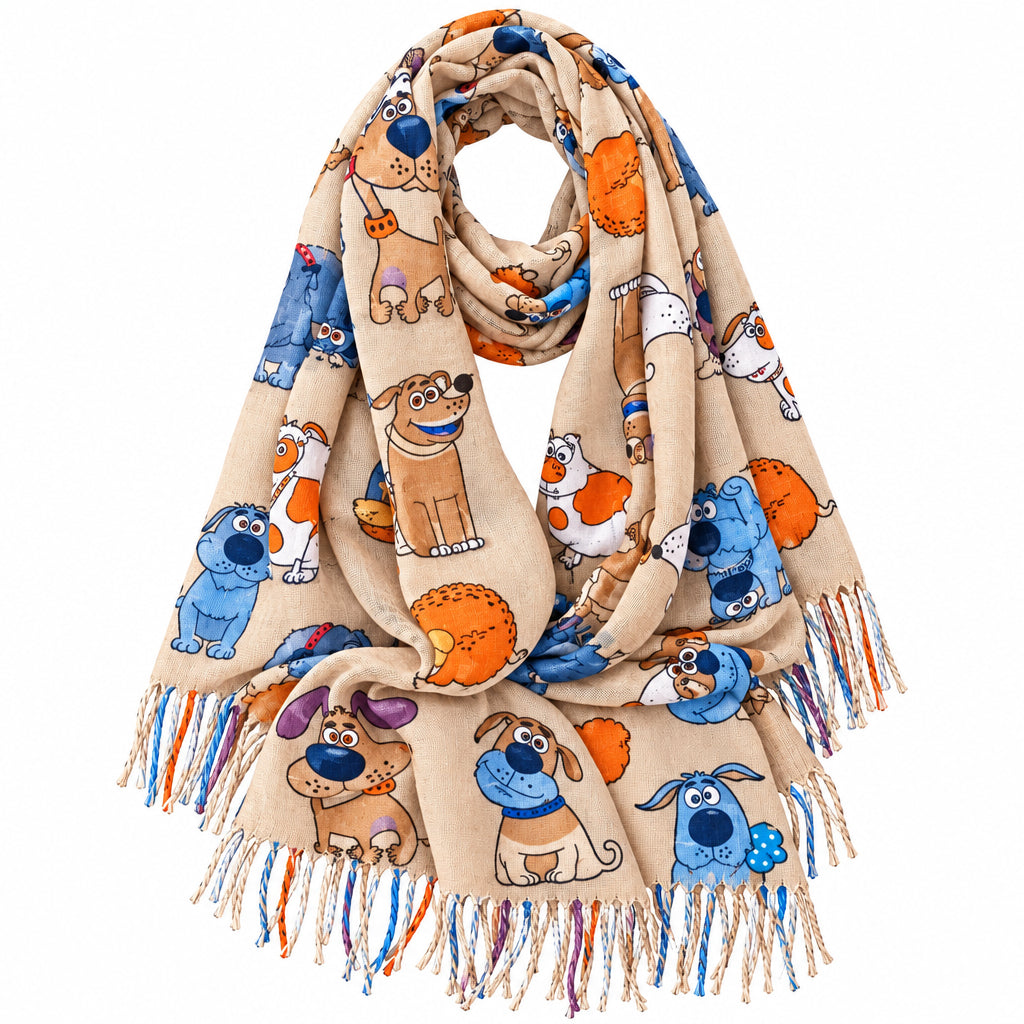A beige fringed scarf featuring a playful cartoon dog print in blue, orange, brown, and white, arranged on a plain white background.