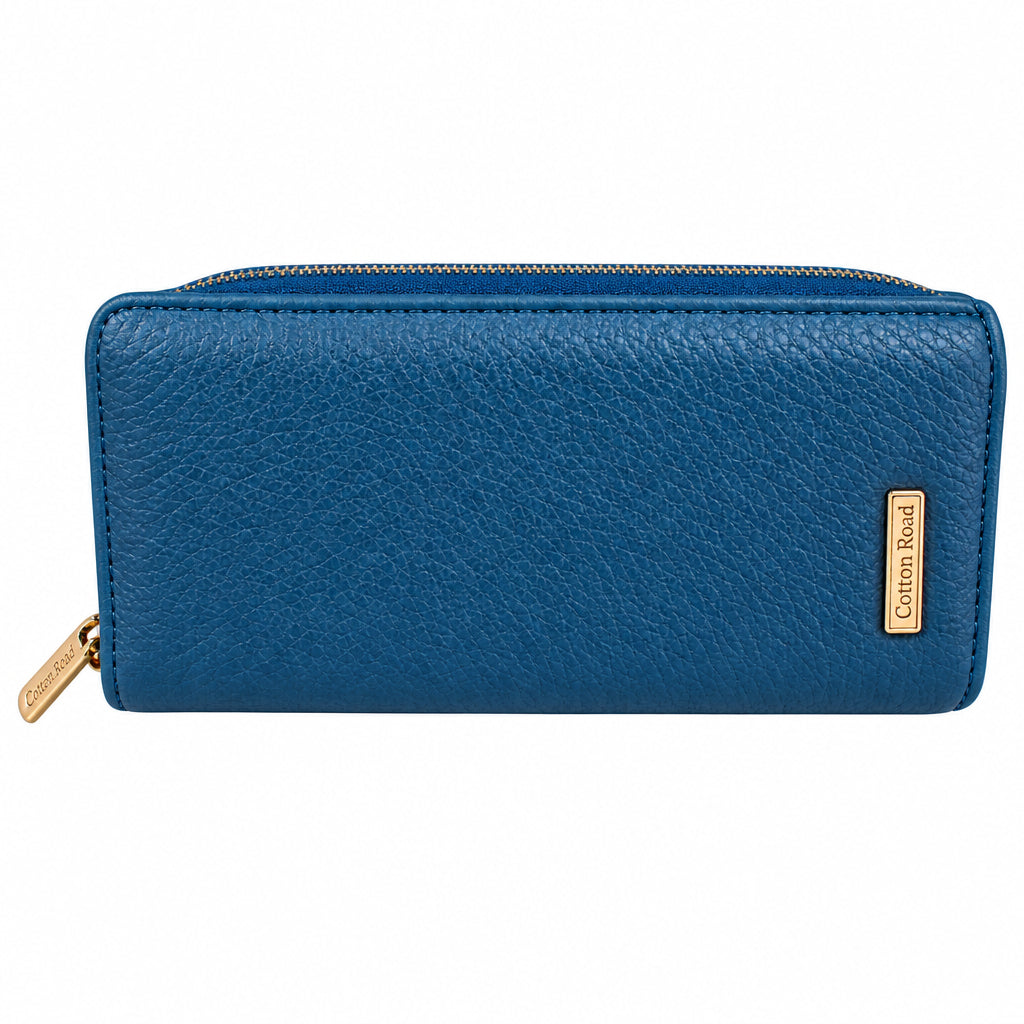 A blue pebbled embossed zip-around wallet with a gold-tone brand plaque on the right side and a matching gold zipper pull, shown against a solid black background.
