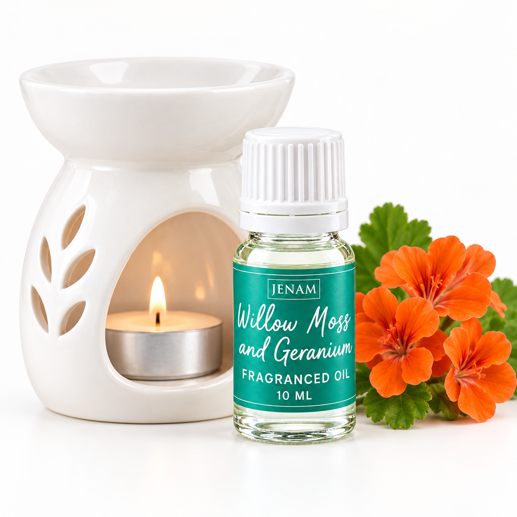 A 10 ml bottle of Jenam Willow Moss and Geranium fragrant oil, styled next to a white ceramic scented candle holder with a lit tea light and orange geranium flowers on a white background.